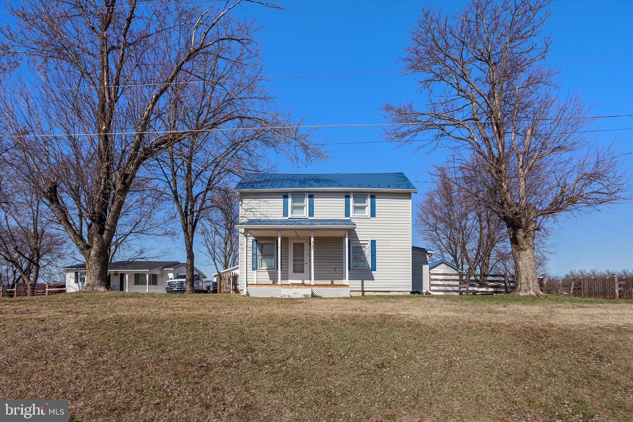 337 Old Charles Town Road Stephenson, VA 22656 - Photo 5 of 27 a view of house with yard and trees in the background