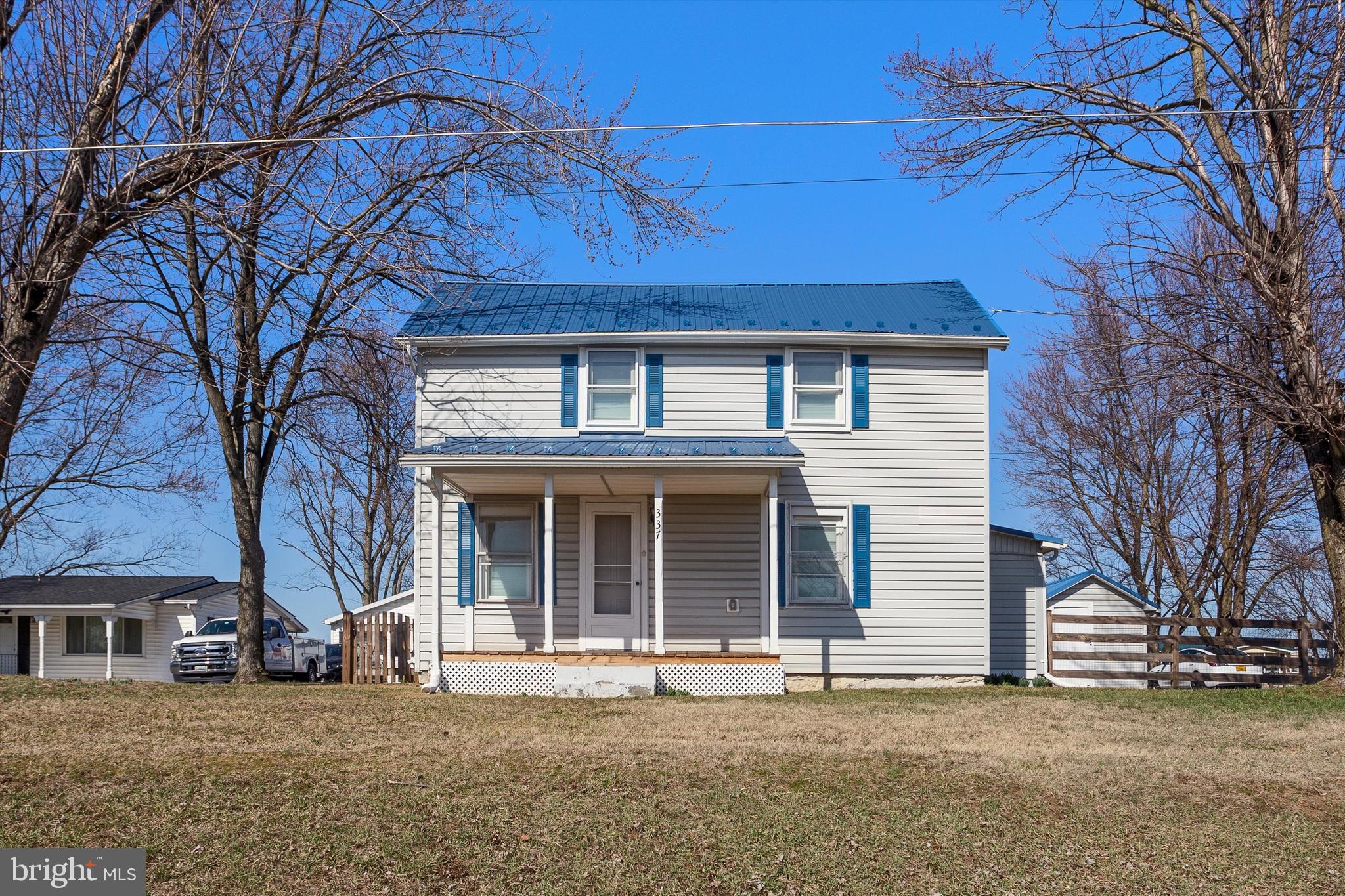 337 Old Charles Town Road Stephenson, VA 22656 - Photo 6 of 27 front view of a house with a large tree
