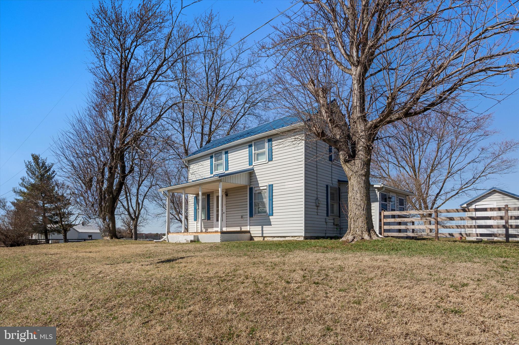 337 Old Charles Town Road Stephenson, VA 22656 - Photo 7 of 27 a backyard of a house with large trees and barbeque