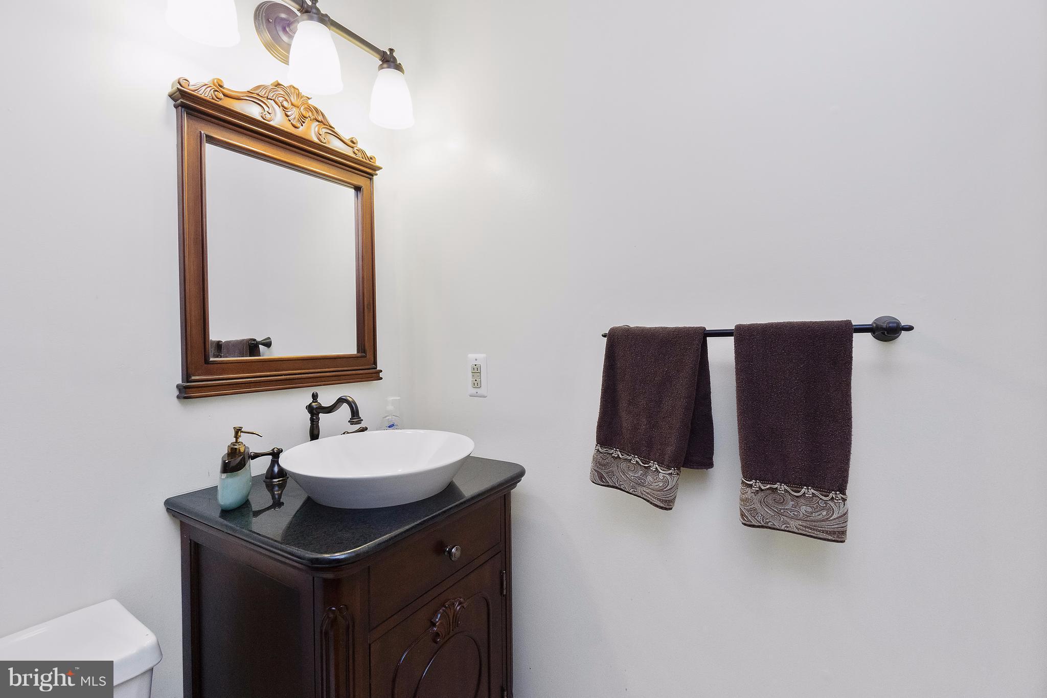 230 Randolph Road Silver Spring, MD 20904 - Photo 11 of 24 a bathroom with a sink and a mirror