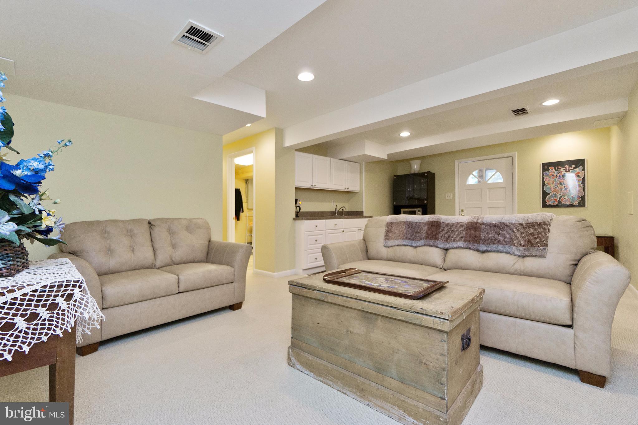 230 Randolph Road Silver Spring, MD 20904 - Photo 15 of 24 a living room with furniture and a large mirror with wooden floor