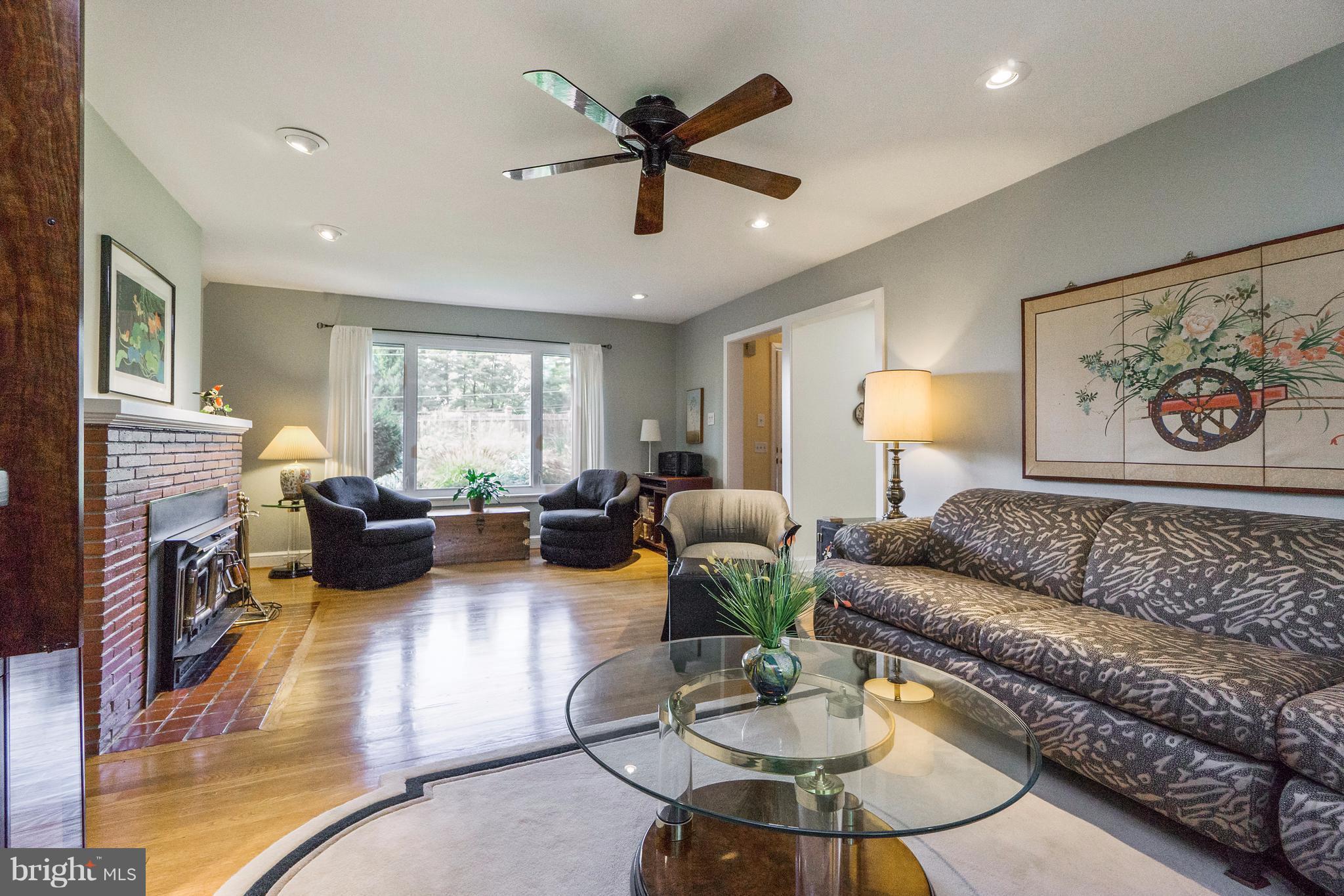 230 Randolph Road Silver Spring, MD 20904 - Photo 5 of 24 a living room with furniture and a large window