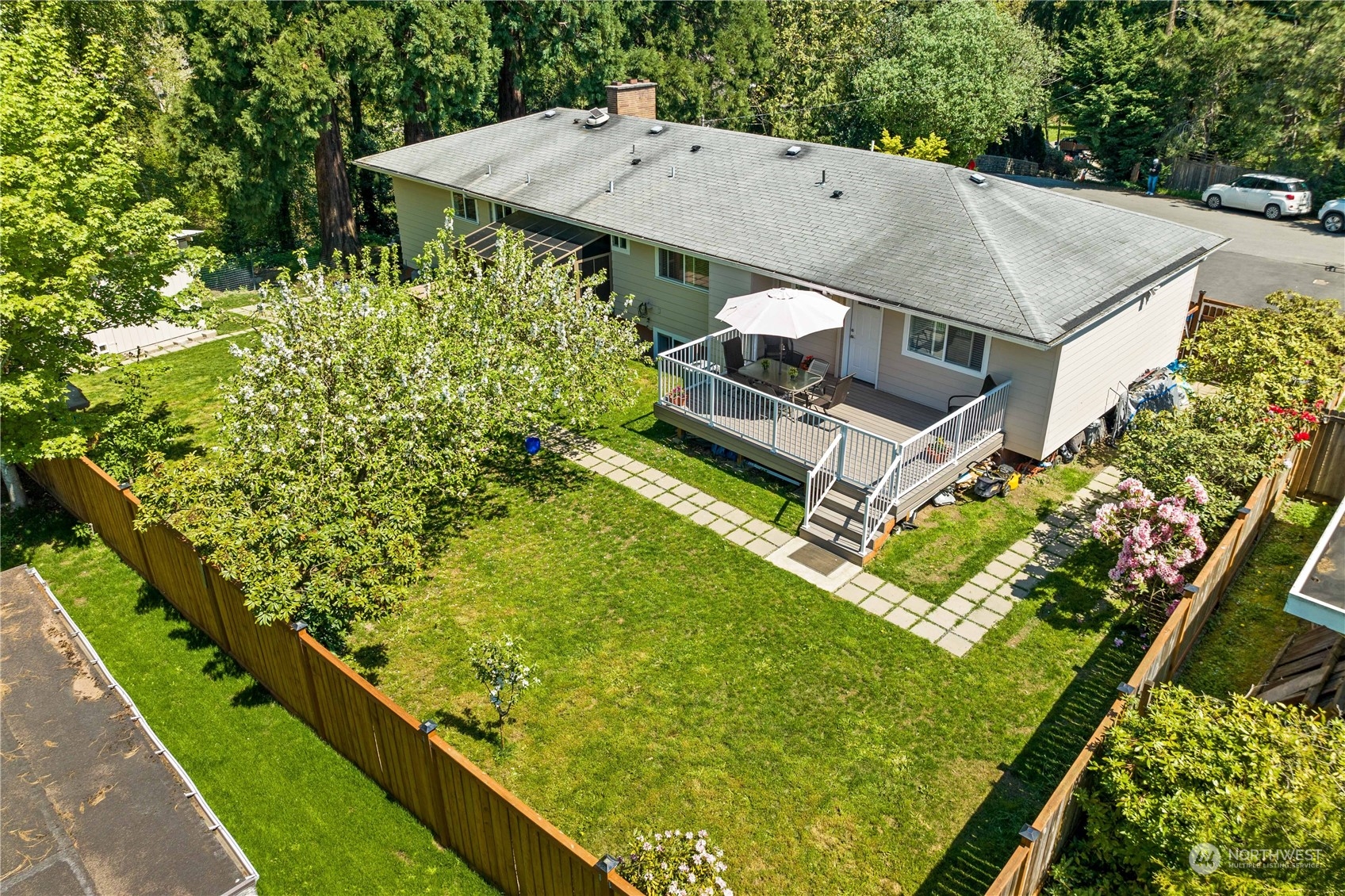 Undisclosed Address Kenmore, WA 98028 - Photo 1 of 1 an aerial view of a house with a garden and swimming pool