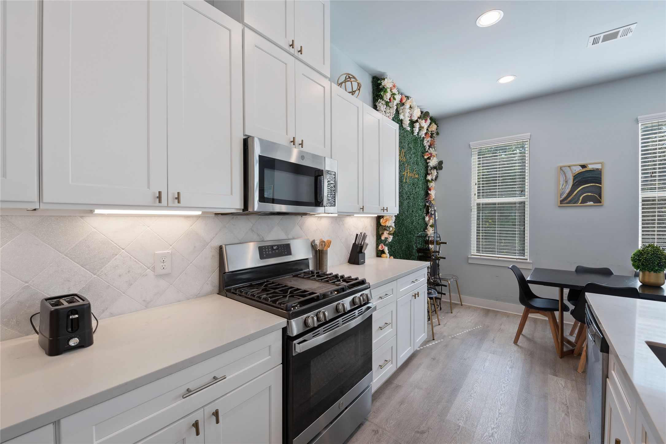 3365 Daphne Street Houston, TX 77021 - Photo 11 of 26 a kitchen with a sink a stove and cabinets
