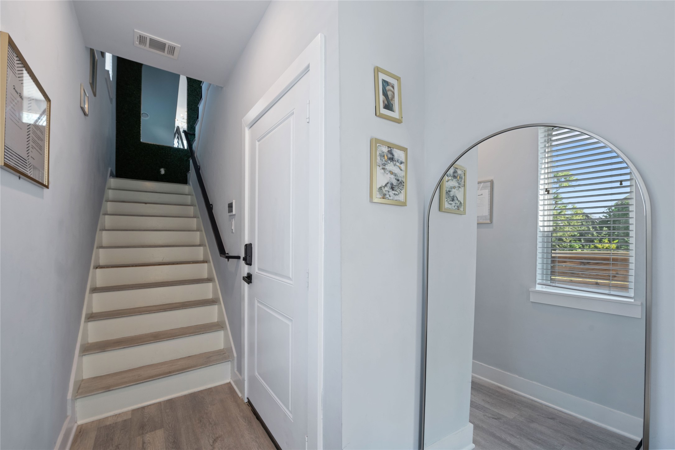 3365 Daphne Street Houston, TX 77021 - Photo 3 of 26 a view of entryway with wooden floor and window