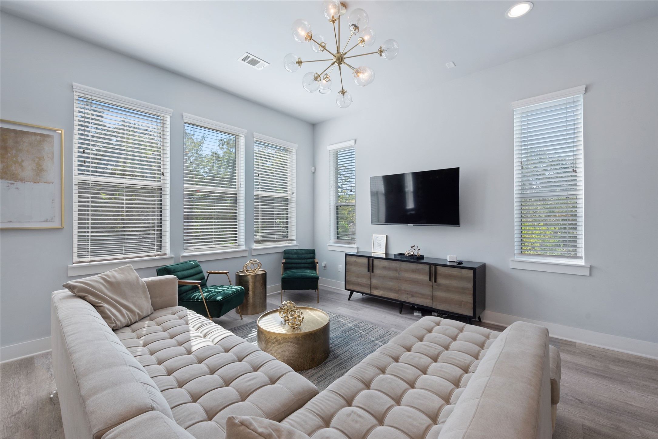 3365 Daphne Street Houston, TX 77021 - Photo 6 of 26 a living room with furniture a flat screen tv and a large window