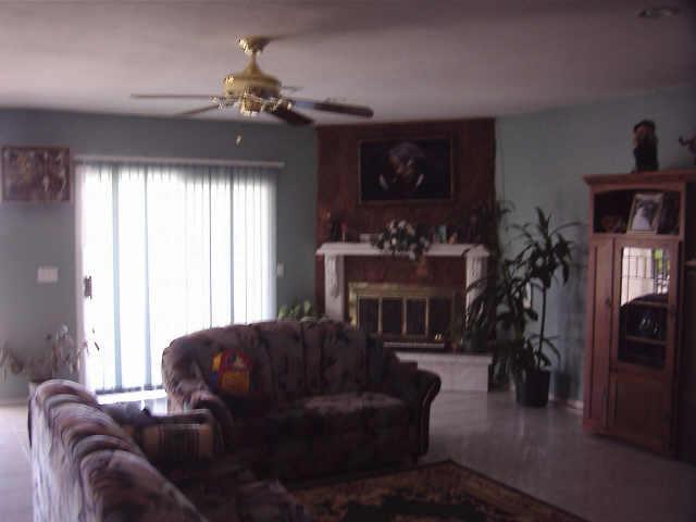 12438 South Gopher Road Buckeye, AZ 85326 - Photo 3 of 4 a living room with furniture and a chandelier
