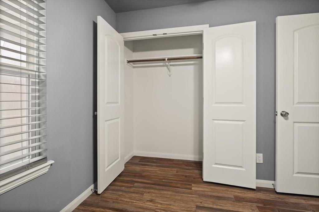 512 Alameda Road Azle, TX 76020 - Photo 18 of 28 a view of a hallway with wooden floor