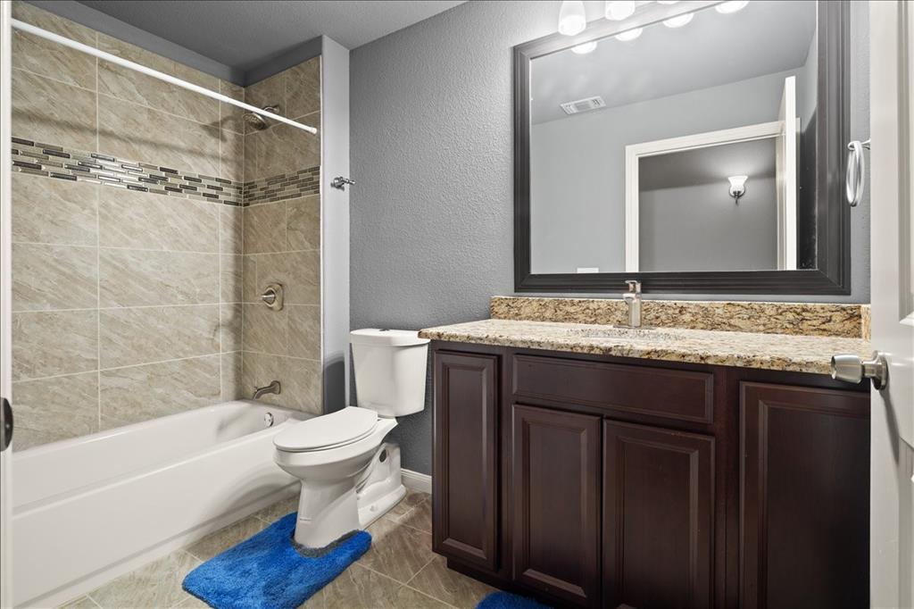 512 Alameda Road Azle, TX 76020 - Photo 19 of 28 a bathroom with a sink and a mirror