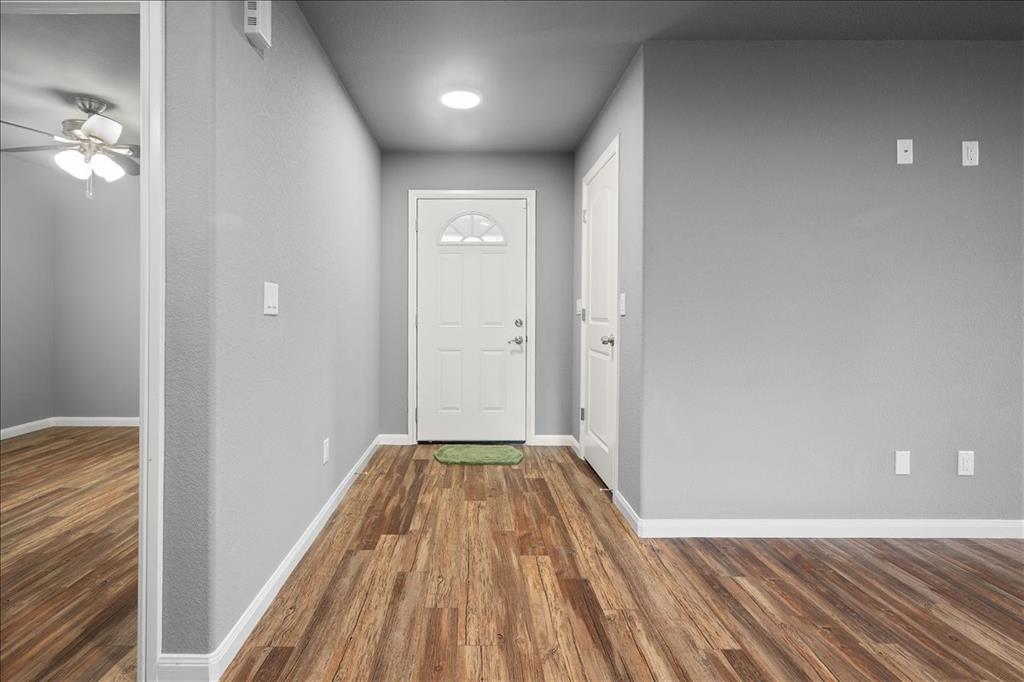 512 Alameda Road Azle, TX 76020 - Photo 3 of 28 a view of a room with wooden floor