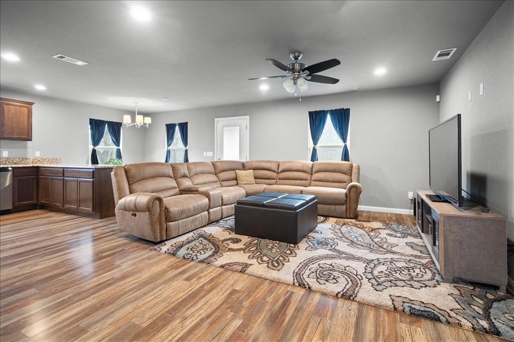 512 Alameda Road Azle, TX 76020 - Photo 4 of 28 a living room with furniture and a flat screen tv
