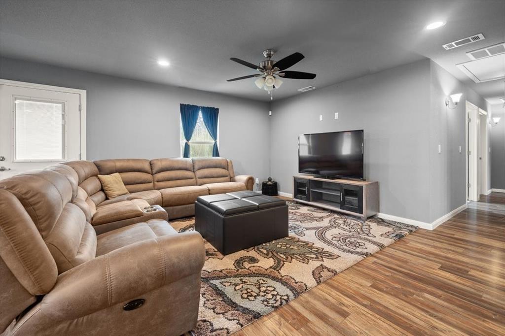512 Alameda Road Azle, TX 76020 - Photo 5 of 28 a living room with furniture and a flat screen tv