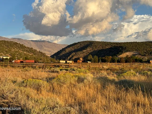 a view of a lake with mountains in the background