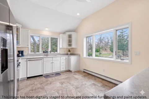 a spacious bedroom with a bed and a couch