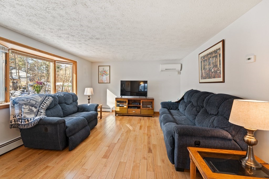7 Lake Ridge Drive Holland, MA 01521 - Photo 11 of 42 a living room with furniture and a flat screen tv