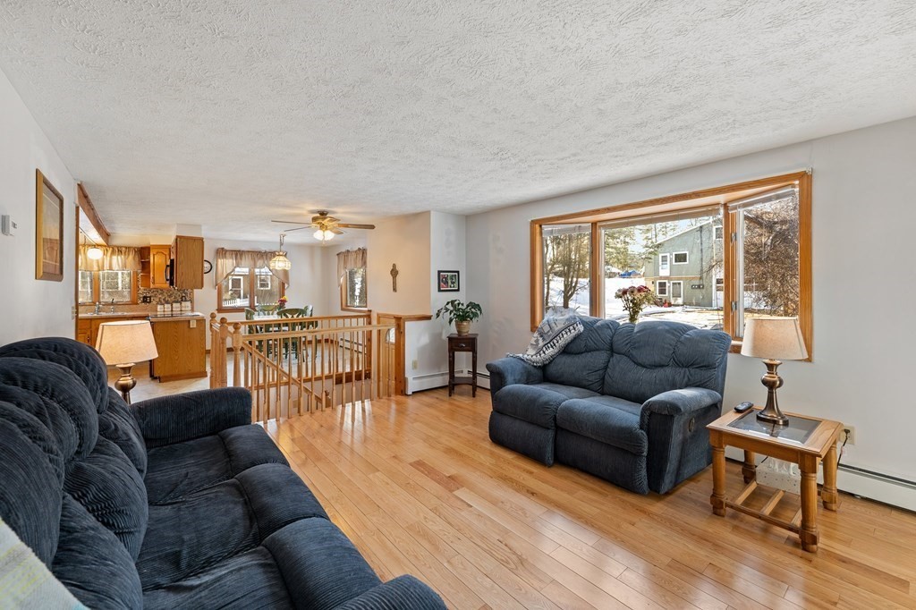 7 Lake Ridge Drive Holland, MA 01521 - Photo 12 of 42 a living room with furniture and a large window