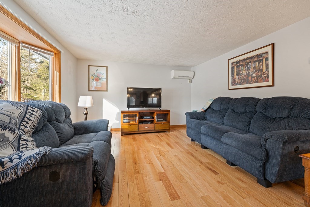 7 Lake Ridge Drive Holland, MA 01521 - Photo 13 of 42 a living room with furniture and a flat screen tv