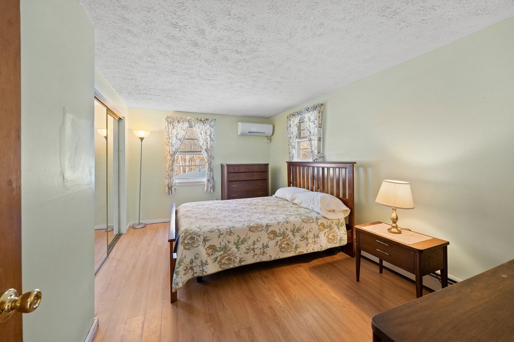7 Lake Ridge Drive Holland, MA 01521 - Photo 15 of 42 a bedroom with a bed and wooden floor