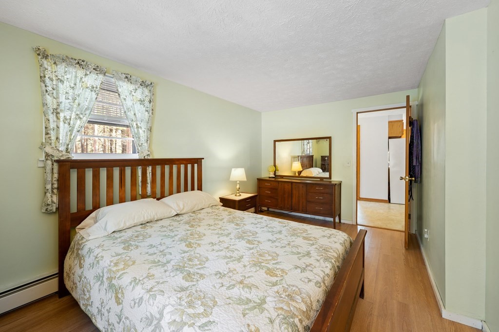 7 Lake Ridge Drive Holland, MA 01521 - Photo 16 of 42 a bedroom with a bed and a flat tv screen on dresser