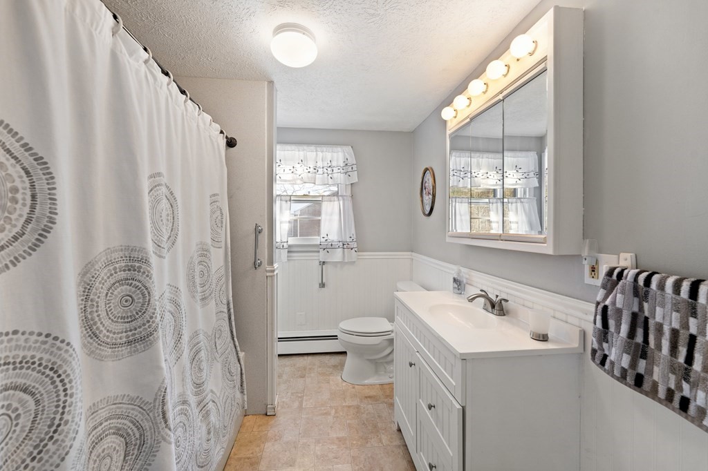 7 Lake Ridge Drive Holland, MA 01521 - Photo 17 of 42 a bathroom with a sink a toilet and a mirror