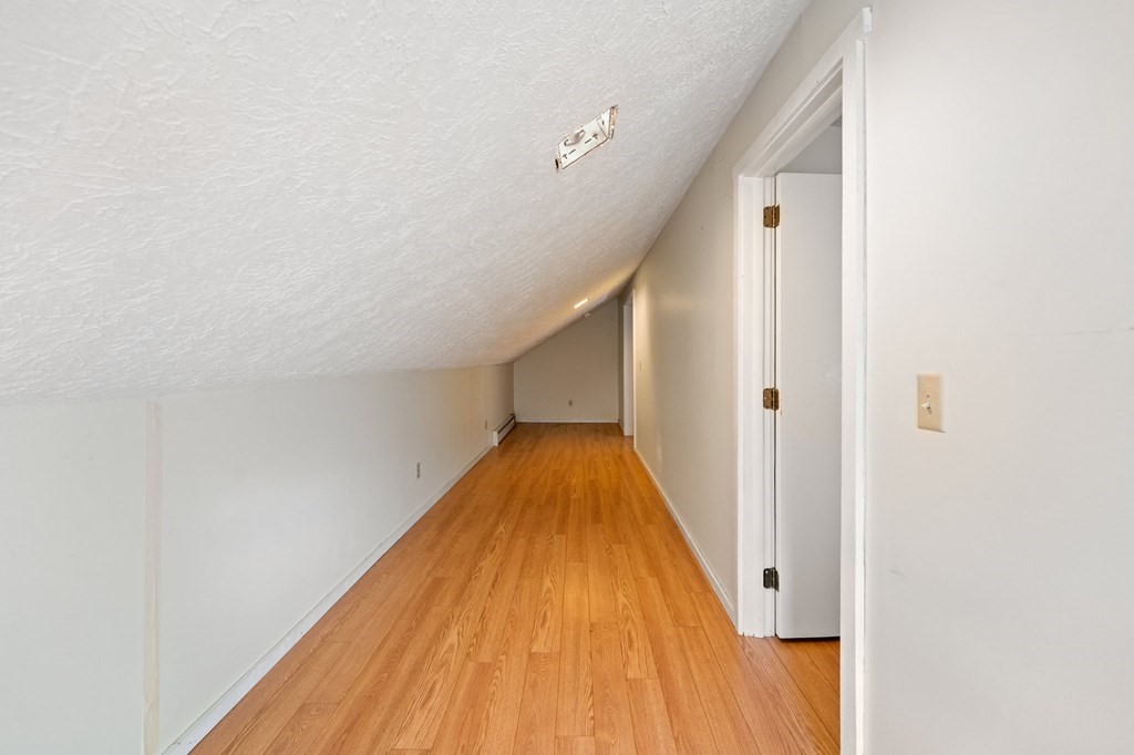 7 Lake Ridge Drive Holland, MA 01521 - Photo 19 of 42 a view of a hallway with wooden floor