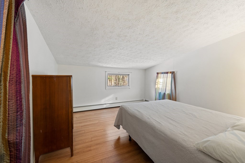 7 Lake Ridge Drive Holland, MA 01521 - Photo 20 of 42 a bedroom with a bed and a window