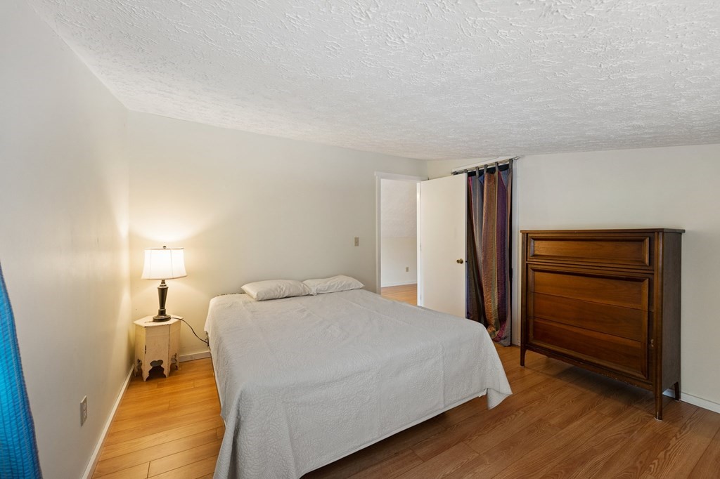 7 Lake Ridge Drive Holland, MA 01521 - Photo 21 of 42 a bedroom with a bed and a dresser