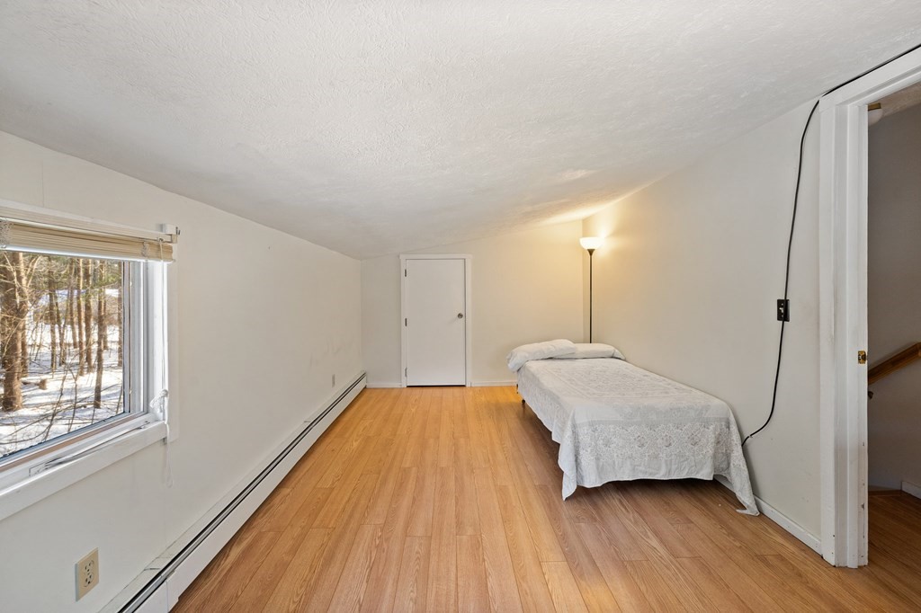7 Lake Ridge Drive Holland, MA 01521 - Photo 22 of 42 a room with a bed and a window