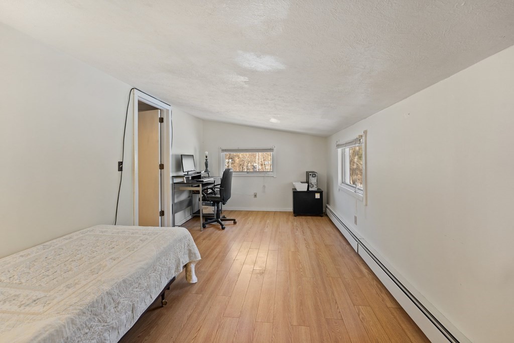 7 Lake Ridge Drive Holland, MA 01521 - Photo 23 of 42 a bed room with a bed and a chair