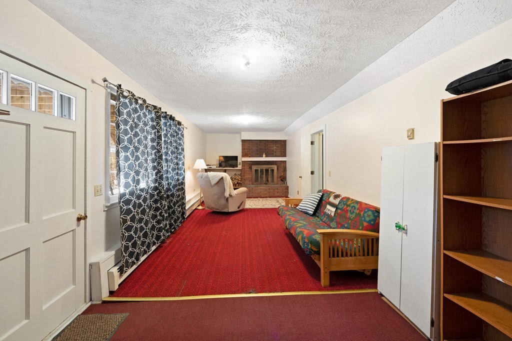 7 Lake Ridge Drive Holland, MA 01521 - Photo 24 of 42 a room with furniture a rug and a window