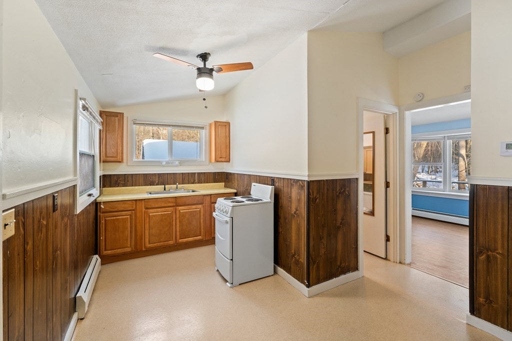 7 Lake Ridge Drive Holland, MA 01521 - Photo 28 of 42 a kitchen with cabinets and stainless steel appliances