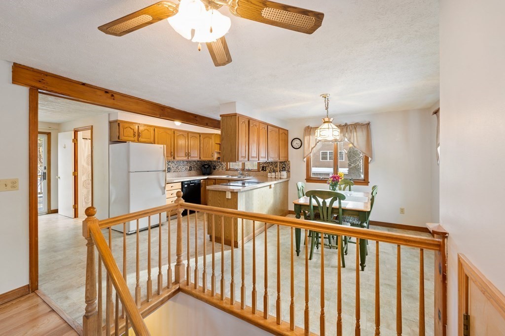 7 Lake Ridge Drive Holland, MA 01521 - Photo 3 of 42 a view of a kitchen with an entryway and chandelier fan