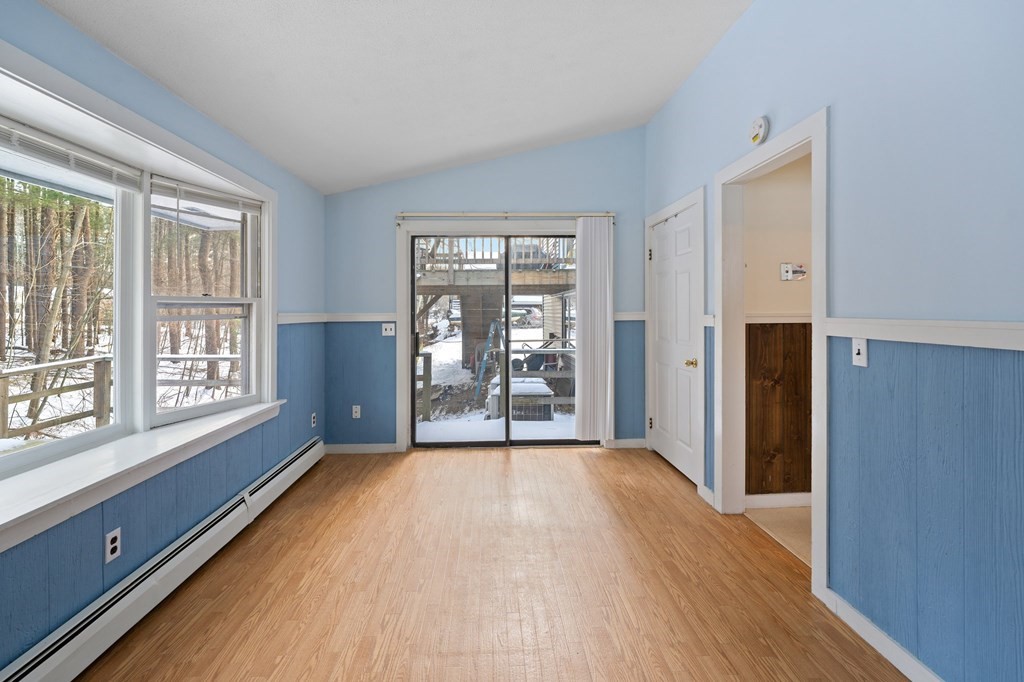 7 Lake Ridge Drive Holland, MA 01521 - Photo 31 of 42 a view of an empty room with wooden floor and a window