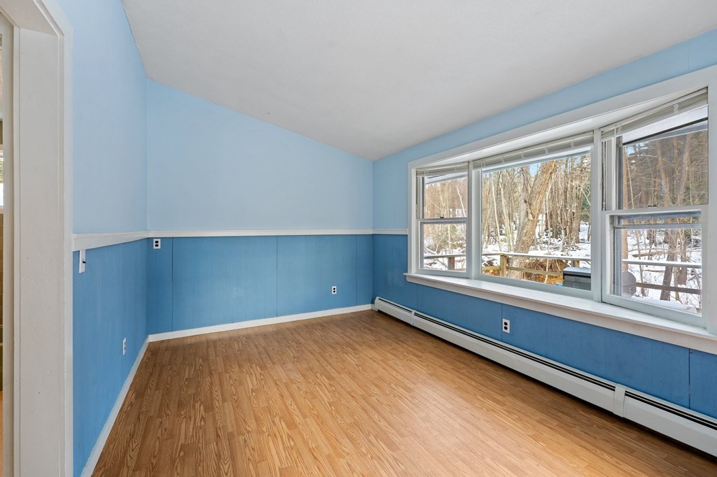 7 Lake Ridge Drive Holland, MA 01521 - Photo 32 of 42 wooden floor in an empty room with a window
