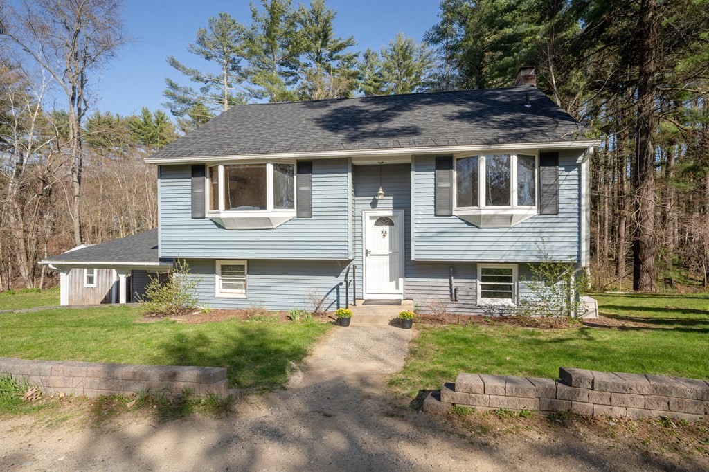 7 Lake Ridge Drive Holland, MA 01521 - Photo 33 of 42 a front view of a house with a yard and garage