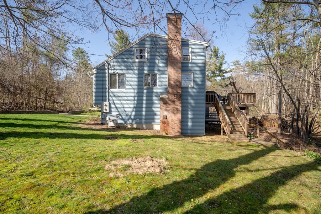 7 Lake Ridge Drive Holland, MA 01521 - Photo 35 of 42 a view of a building with a yard