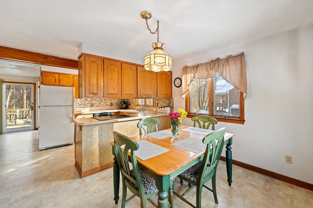 7 Lake Ridge Drive Holland, MA 01521 - Photo 7 of 42 a view of a dining room with furniture window and outside view