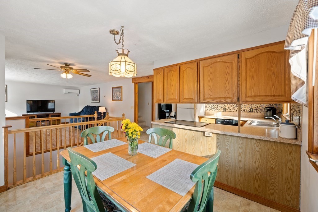 7 Lake Ridge Drive Holland, MA 01521 - Photo 8 of 42 a view of a dining room with furniture window and wooden floor