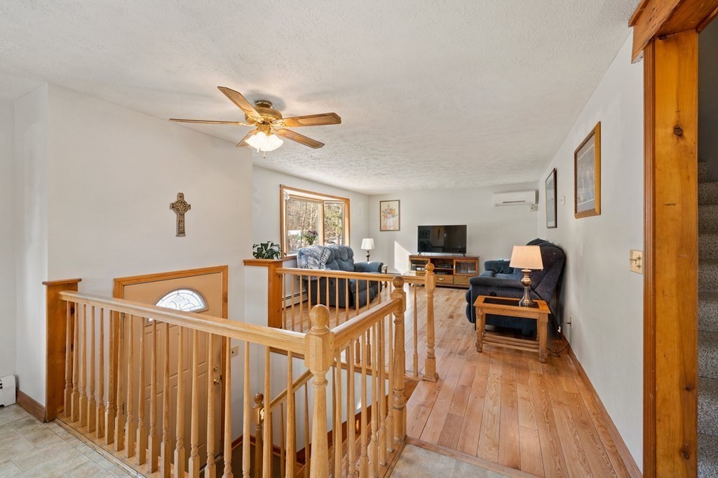 7 Lake Ridge Drive Holland, MA 01521 - Photo 10 of 42 a living room with furniture and a wooden floor