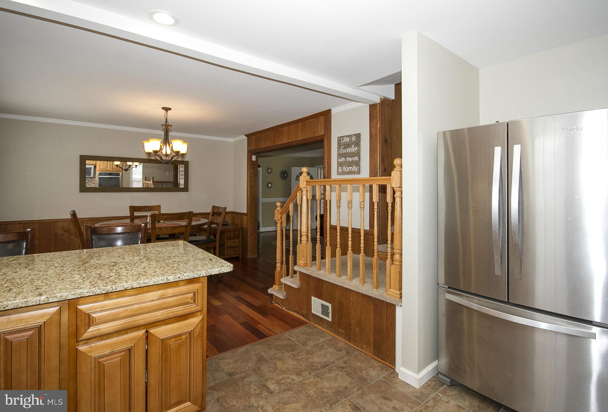 3605 Stoneybrook Road Randallstown, MD 21133 - Photo 12 of 25 a kitchen with stainless steel appliances granite countertop a refrigerator and a sink