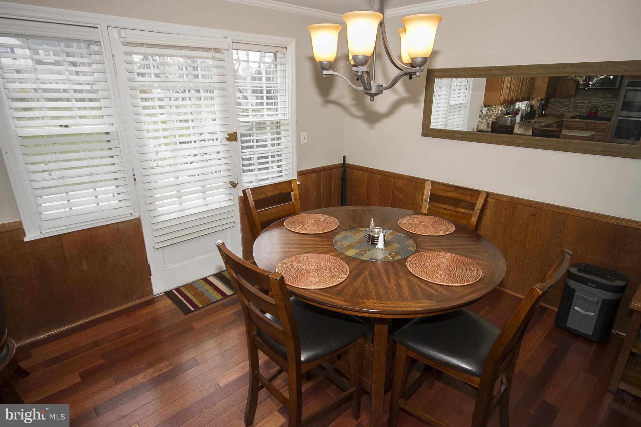 3605 Stoneybrook Road Randallstown, MD 21133 - Photo 15 of 25 a view of a dining room with furniture and wooden floor