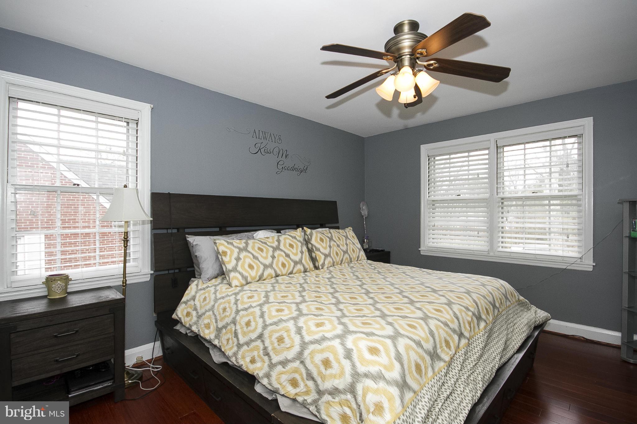 3605 Stoneybrook Road Randallstown, MD 21133 - Photo 16 of 25 a bedroom with a bed and a chandelier