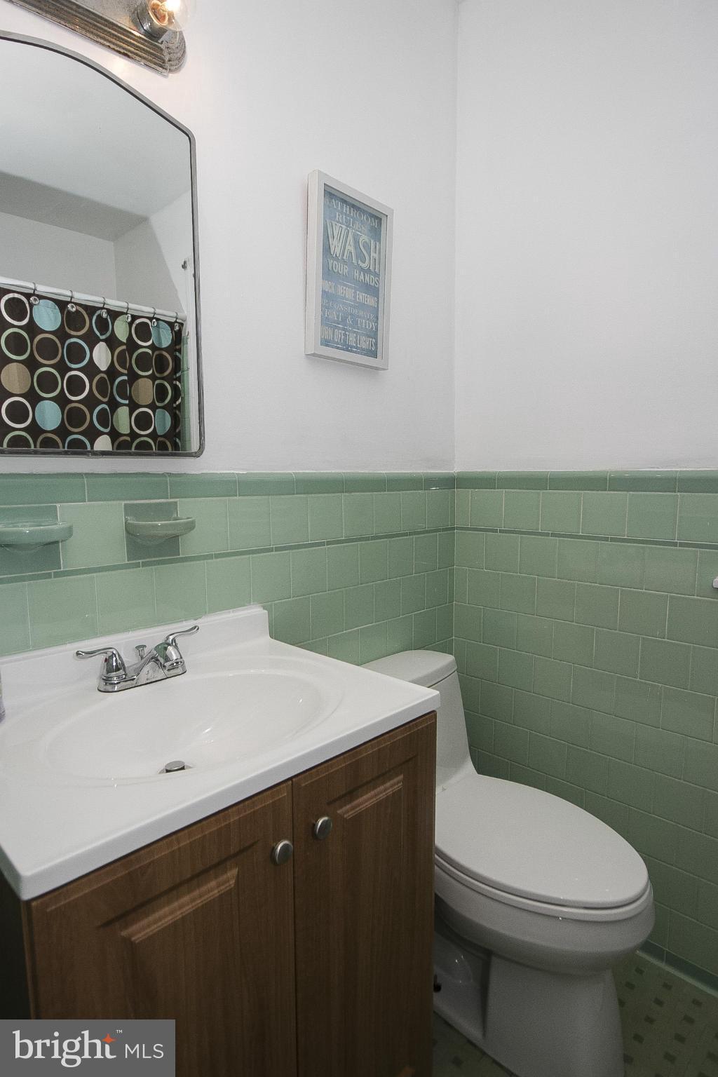 3605 Stoneybrook Road Randallstown, MD 21133 - Photo 18 of 25 a bathroom with a sink mirror and toilet