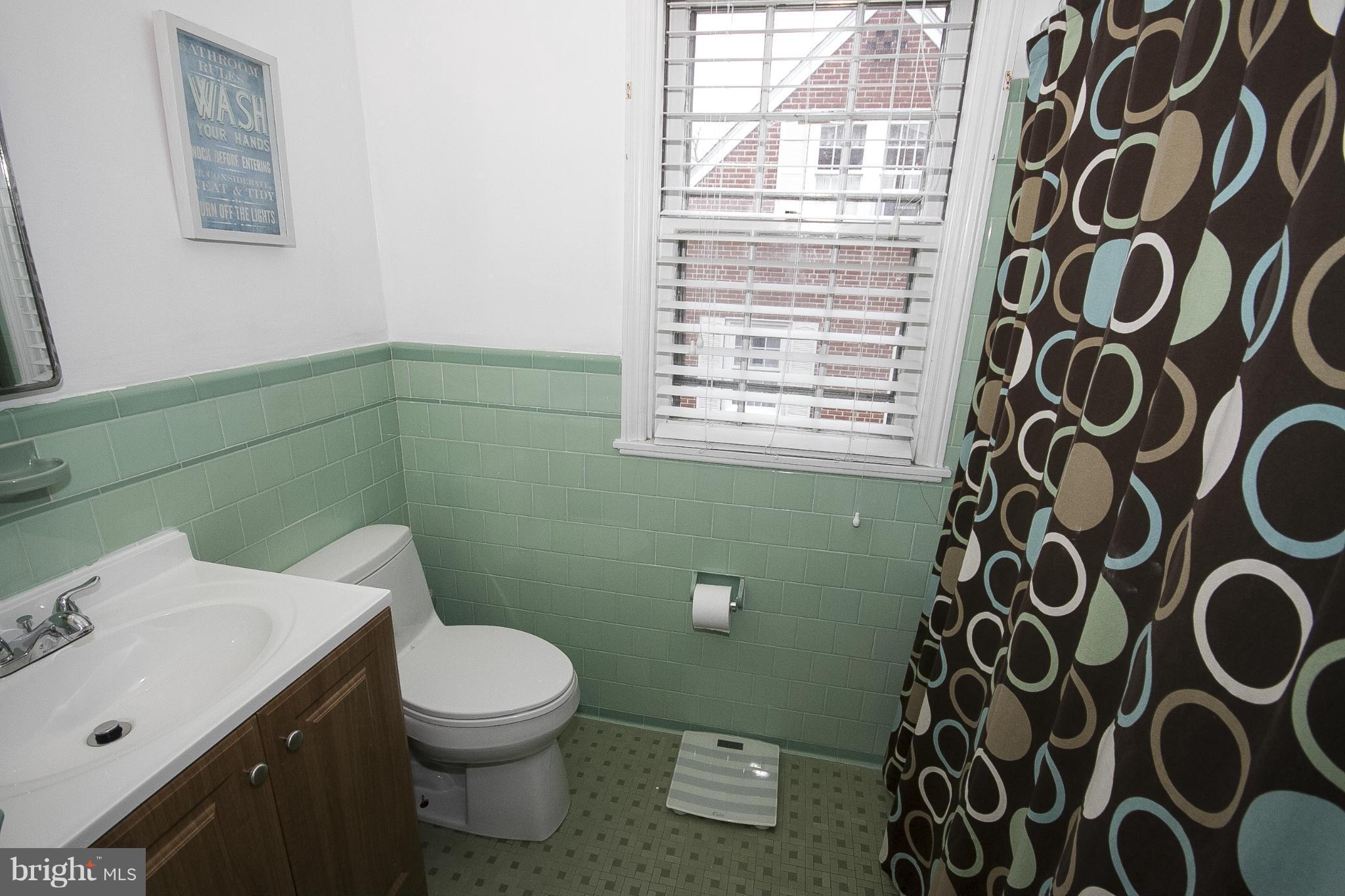 3605 Stoneybrook Road Randallstown, MD 21133 - Photo 19 of 25 a bathroom with a toilet and a sink