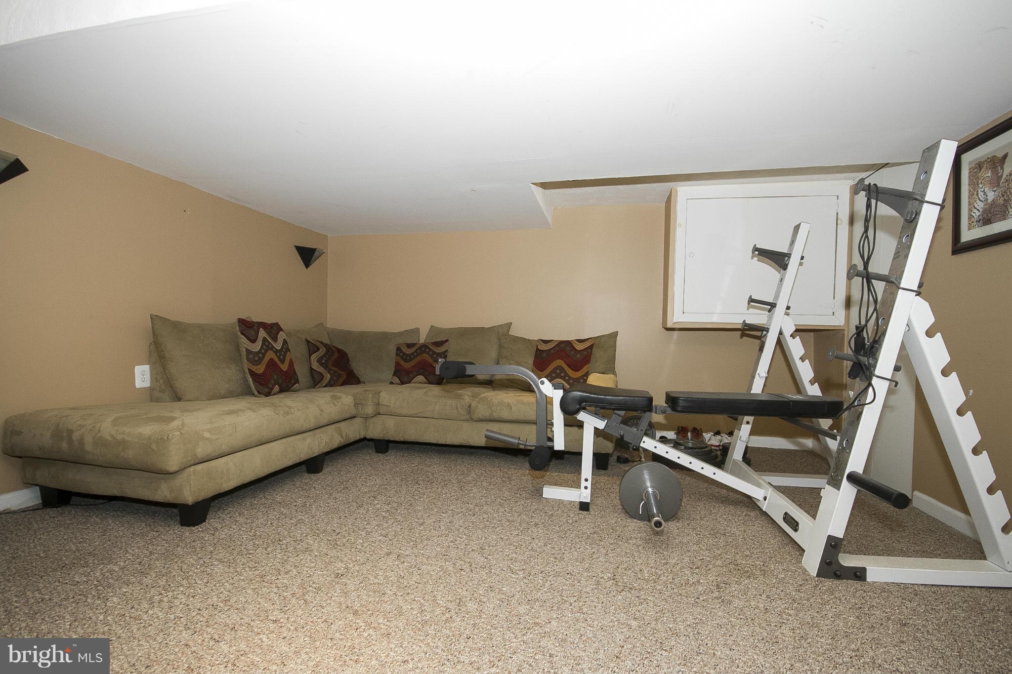 3605 Stoneybrook Road Randallstown, MD 21133 - Photo 21 of 25 a living room with furniture and a air conditioner vent