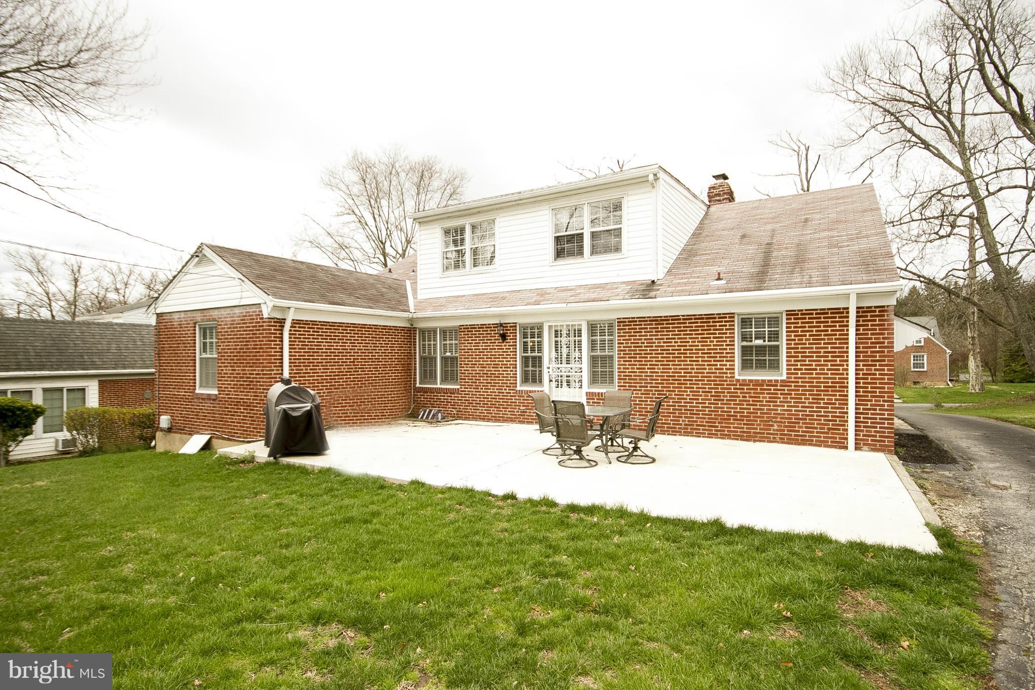3605 Stoneybrook Road Randallstown, MD 21133 - Photo 24 of 25 a house view with a sitting space and garden