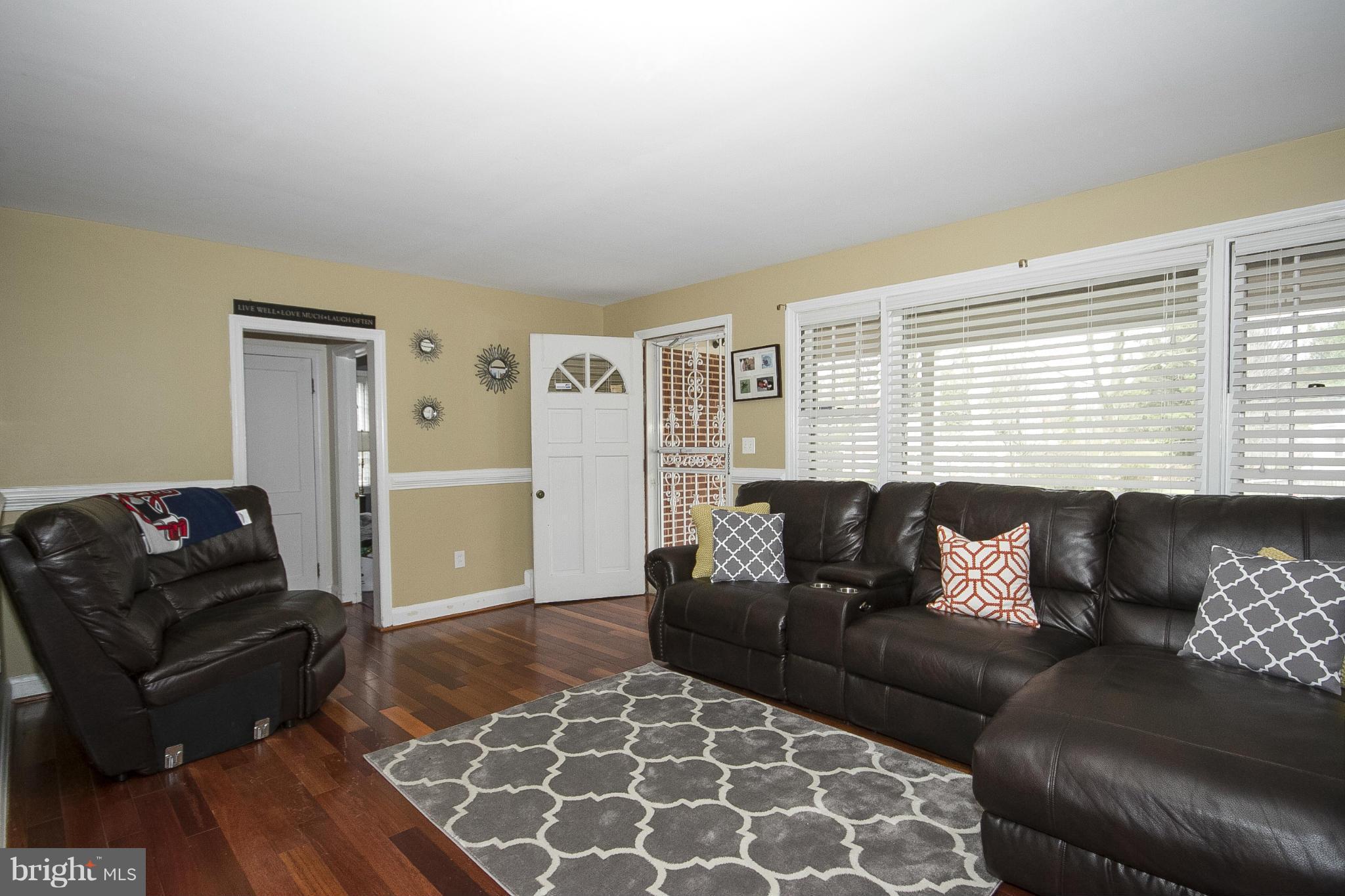 3605 Stoneybrook Road Randallstown, MD 21133 - Photo 5 of 25 a living room with furniture and a window