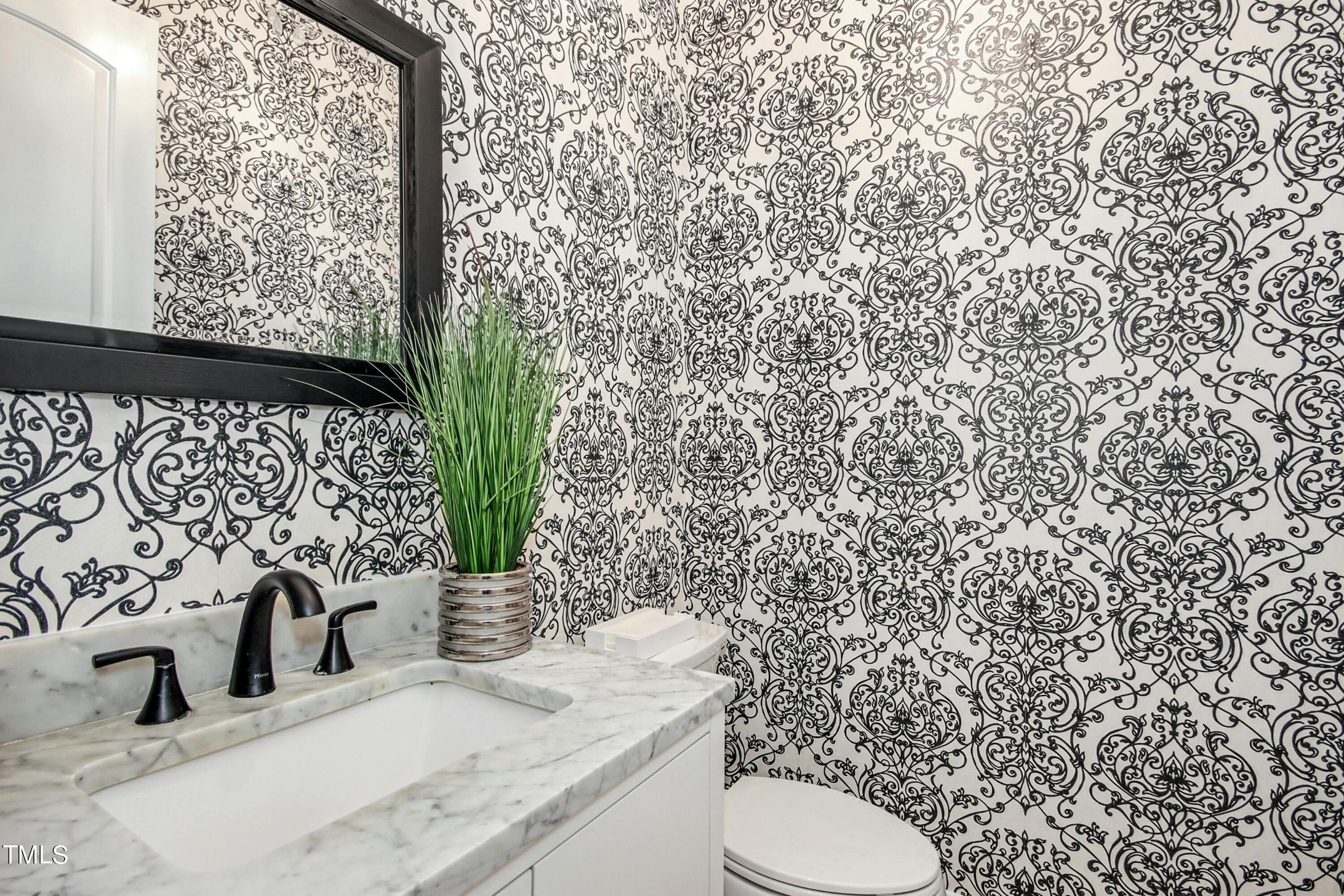 5513 Hickory Leaf Drive Raleigh, NC 27606 - Photo 13 of 41 a bathroom with a granite countertop sink and a toilet