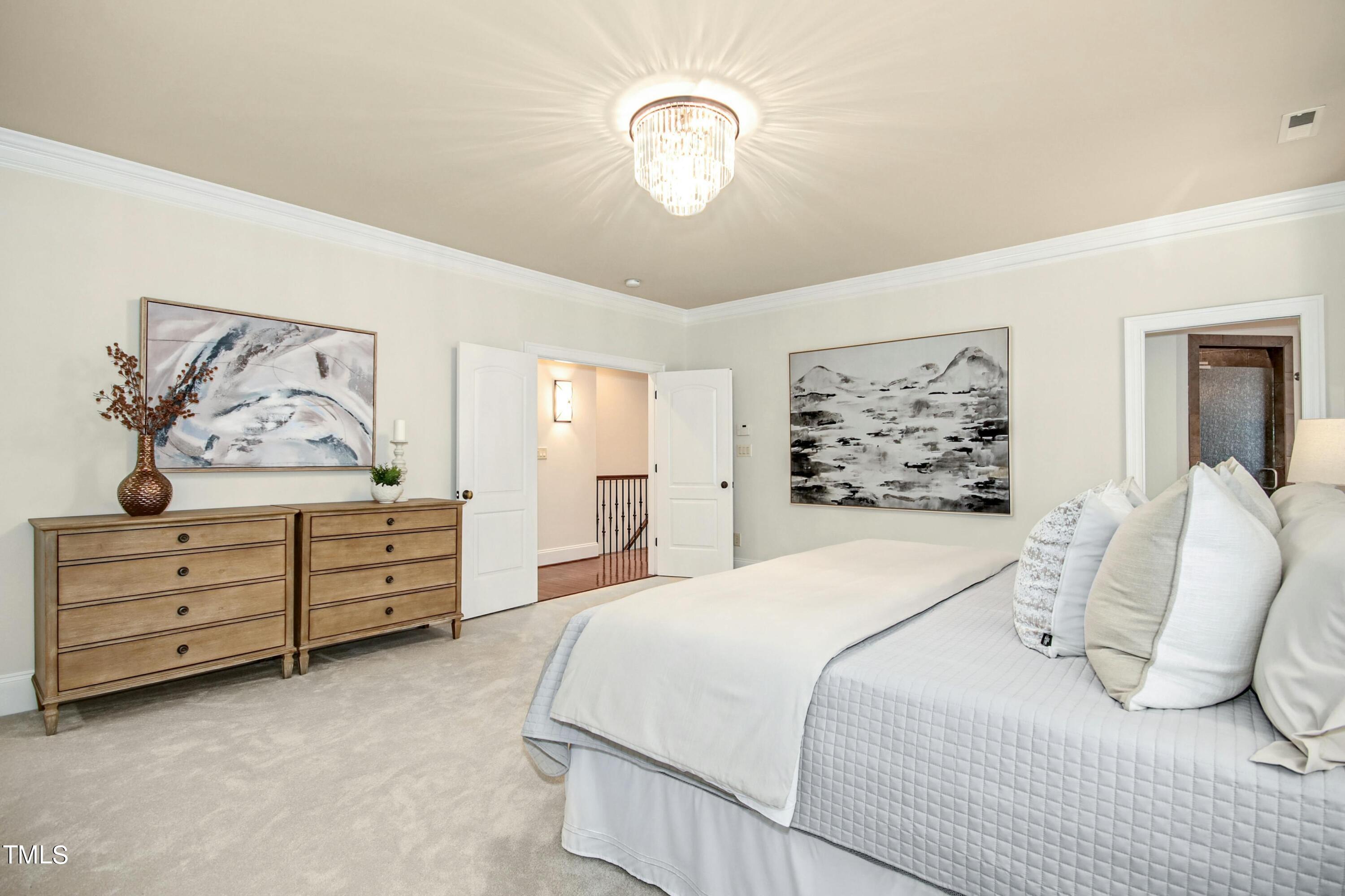 5513 Hickory Leaf Drive Raleigh, NC 27606 - Photo 15 of 41 a bedroom with a bed and painting on the wall