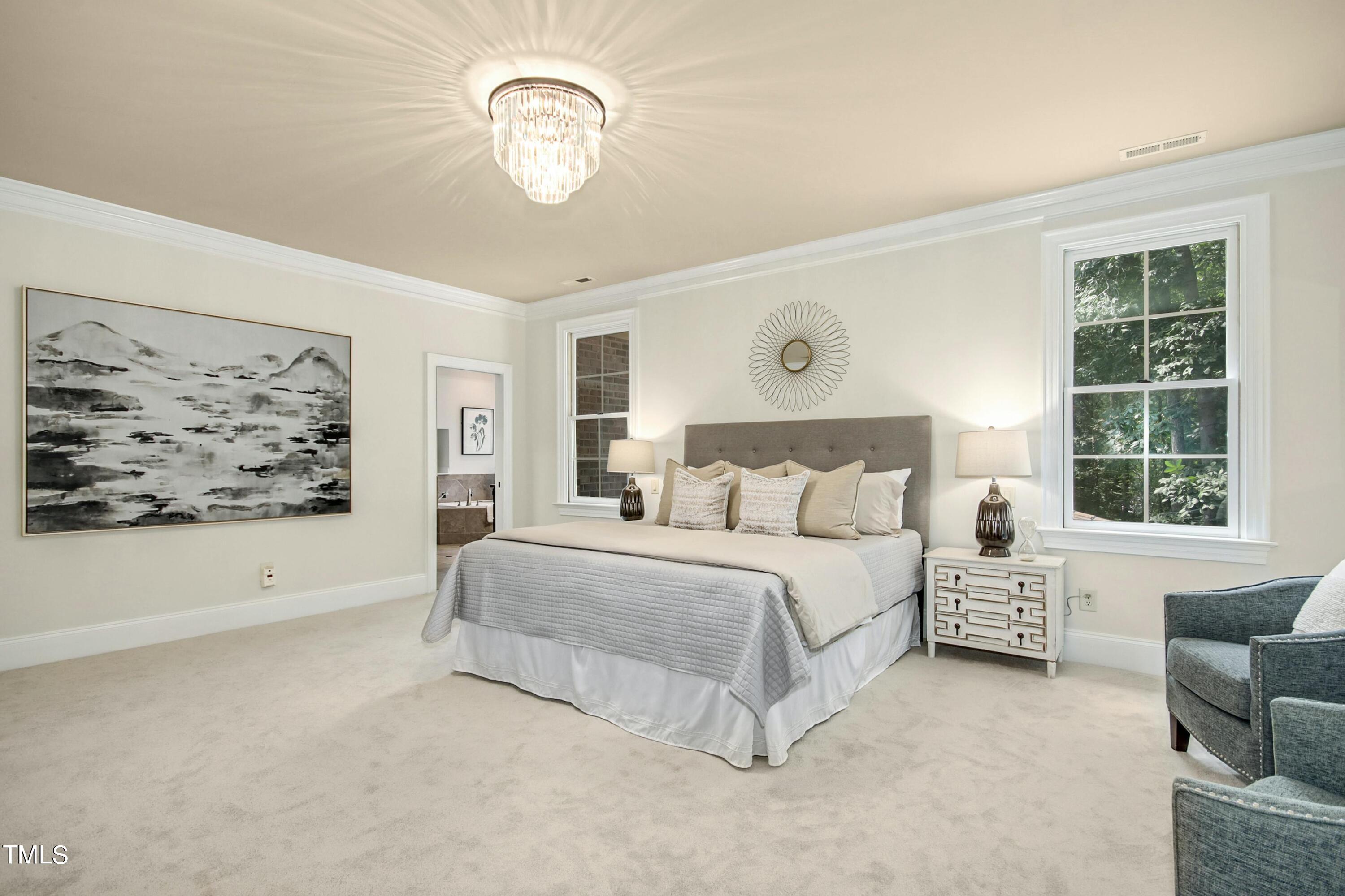 5513 Hickory Leaf Drive Raleigh, NC 27606 - Photo 16 of 41 a spacious bedroom with a bed and a window